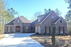 a large brick house with lots of windows