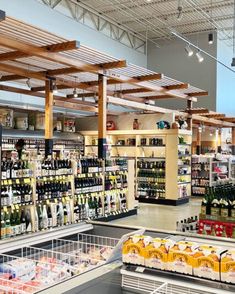 an empty grocery store filled with lots of food and drink bottles in it's shelves