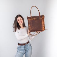 This handmade women tote bag is produced of distressed cowhide leather. It has one pocket inside. The bag has a high-quality zipper that secures your belongings. It holds the shape perfectly and you may be confident that your personal things like cell phone, tablet, lap-top are safe. This bag is simple, reliable, and durable. Its universal look allows to use the tote bag for various purposes. One may take the bag to the work, shopping, meeting, or walk and feel comfortable with it at any conditions. SIZE and DIMENSIONS:       〰️ SMALL 〰️ Height: 12 inches (30 cm) Width (the top): 12.6 inches (32 cm) Width (the bottom): 9 inches (23 cm) Depth: 4.3 inches (11 cm)      〰️ MEDIUM 〰️ Height: 13.4 inches (34 cm) Width (the top): 14.6 inches (37 cm) Width (the bottom): 11 inches (28 cm) Depth: 4. Distressed Brown Bags For Everyday Use, Distressed Brown Shoulder Bag For Everyday Use, Distressed Brown Oiled Leather Bag For Daily Use, Distressed Brown Waxed Bags For Daily Use, Distressed Brown Waxed Finish Bag For Daily Use, Distressed Brown Waxed Finish Shoulder Bag For Daily Use, Lap Top, Personal Things, Leather Totes