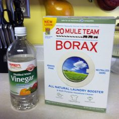 a bottle of borax sitting on top of a counter next to a sign