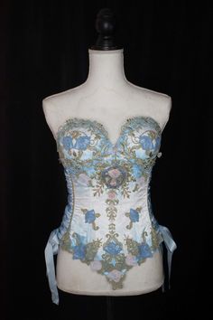 Satin cupped corset with various ornamental embroidery. It has plastic boning with steel bone reinforcements and lace-up sides. The corset is airbrushed with an ombre color. Made to order to buyer's measurements. Custom Color requests are welcome. Cupped Corset, Faerie Costume, Wicked Costumes, Floral Teacup, Corset Fashion, Floral Corset, Geek Fashion, Prom Designs, Birthday Outfits