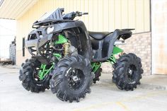 a large four wheeler parked in front of a building