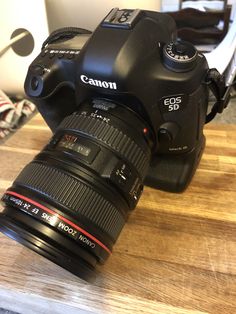 a camera sitting on top of a wooden table