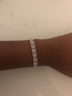 This is a simple chevron pattern friendship bracelet. It is dark blue, purple, Light blue, and white. Simple Chevron Bracelet, Casual Purple Friendship Bracelets, Cute Chevron Bracelet Colors, Trendy Blue Hand-strung Friendship Bracelets, Purple Chevron Bracelet, Chevron Friendship Bracelet, Chevron Friendship Bracelets, Chevron Bracelet, Cute Friendship Bracelets