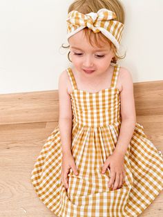 Pretty handmade girls summer dress. Pretty sweetheart neckline.  Back of the dress ties with a bow.  Pockets!  Skirt length just above the knee. Head scarf included x Made from beautiful mustard & white gingham fabric - 100% cotton. * Sizes 2 to 6 available for order Please note these dresses are made to order.  Please allow 2 weeks for your custom order to be made x Cotton Frocks For Kids, Frocks For Kids, Handmade Girls Dress, Cotton Frocks, Dress Bow, Dress Pretty, Handmade Dress, Gingham Fabric, Handmade Clothing