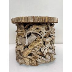 a piece of driftwood is stacked on top of another piece of driftwood that has been turned into a planter