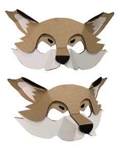 two masks made out of cardboard, one with a fox's head