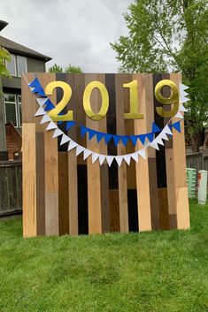 a wooden sign that says happy new year