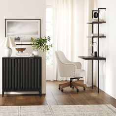 a white chair sitting next to a wooden cabinet on top of a hard wood floor