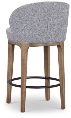 an upholstered stool with wooden legs and grey fabric seat pad, viewed from the front