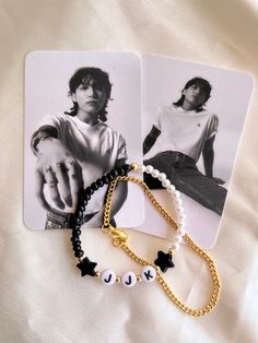 The JJK (Jeon Jungkook) set includes:  1 14k gold filled mini vine chain bracelet 1 half pearl, half obsidian seed bead stretch bracelet with JJK initials between 2 star beads  2 photo cards  *2 photo cards will vary*  Please message me for any additional sizing Friendship Bracelets Inspiration, Jungkook Beaded Bracelet, Black Kpop Style Jewelry With Letter Beads, Jungkook Bracelet Beads, Jungkook Beaded Necklace, Silver Beaded Kpop Bracelets As Gift, Jungkook Bracelet, Handmade Black Beaded Kpop Bracelet, Kpop Freebies