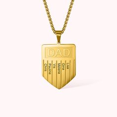 a gold necklace with the words dad on it