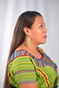 These statement pieces enhance an elegant look or brighten a simple T-shirt kind of day. Hand crafted in the Highlands of Guatemala by skilled artisans. Handmade in Sololá, Guatemala. Made of glass seed beads and nylon/cotton cord. Hypoallergenic Please note- colors may fade with sun exposure 2 ¾ long 1 inches wide Due to the handmade nature of the earrings, size may vary slightly Multicolor Fair Trade Beaded Earrings, Adjustable Macrame Beaded Earrings, Multicolor Woven Earrings For Beach, Beach Multicolor Woven Earrings, Multicolor Woven Beach Earrings, Casual Multicolor Earrings For Vacation, Handwoven Beaded Earrings For Summer Beach, Multicolor Woven Adjustable Beaded Earrings, Handwoven Beaded Earrings For Beach In Summer