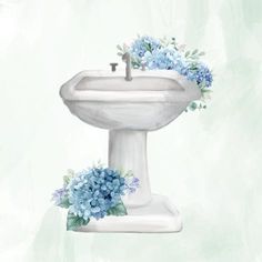 a white pedestal sink with blue flowers on it