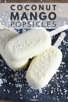 three popsicles sitting on top of a cutting board