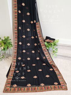 Blouse stitched - Yes Blouse size - 36 with inner margins expandable upto 42 For Blouse Size 34 alteration can be done on request. Fall/pico - Yes done Formal Saree With Embroidered Border, Elegant Black Saree With Embroidered Border, Fitted Traditional Wear With Embroidered Border For Formal Occasions, Black Dupatta With Border For Wedding, Black Wedding Dupatta With Border, Black Unstitched Embroidered Fabric With Border, Unstitched Black Embroidered Fabric With Embroidered Border, Black Embroidered Saree For Eid, Black Saree With Embroidered Border For Eid