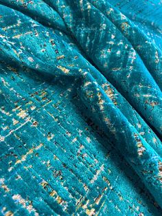 an up close shot of a blue blanket