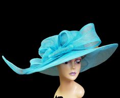 All Sinamay, With a large loops Turquoise Wide Brim Hat For Kentucky Derby, Turquoise Summer Hats, Turquoise Hat For Kentucky Derby Races, Elegant Turquoise Hat For Spring, Turquoise Hats For Spring Races, Elegant Turquoise Hat For Races, Elegant Turquoise Summer Hat, Blue Wide-brim Hat For Day Out, Turquoise Brimmed Summer Hat