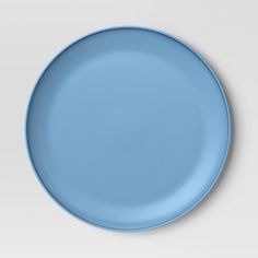 an empty blue plate on a white background