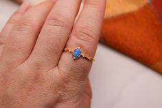 This listing is for one adjustable ring. Made with 14k gold fill and synthetic opal, it's stunning and durable. Adjustable 14k Gold Opal Ring Gift, Dainty Adjustable Opal Ring Gift, Dainty Opal Ring Gift, Dainty Blue Opal Ring For Gift, Dainty Yellow Gold Opal Ring As Gift, Gold Opal Birthstone Ring As Gift, Adjustable Opal Ring For Gift, Opal Gold Ring, Jewelry Opal