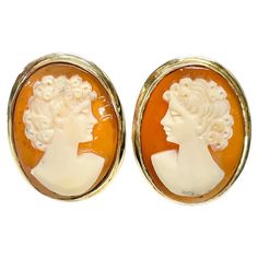 Vintage 14 Karat Shell Cameo Earrings. The earrings feature a bezel-set traditional lady cameo with post and Omega clip back. Each earring measures approximately 20 x 15mm. On one earring the lady is facing left and on the other the lady is facing right. Stamped on the back on the bottom of the clip is 14K. The total gold weight is 8.01 grams. Elegant Pouch, Diamond Cufflink, Cocktail Earrings, Bling Earrings, Cameo Earrings, Cameo Jewelry, Gold Cufflinks, Italian Jewelry, Carved Shell