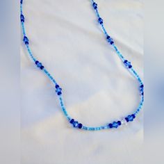 Beautiful Light And Dark Blue Crystal Sparkle Bead Necklace Blue Single Strand Necklace For Beach, Blue Spacer Beads Jewelry For The Beach, Blue Tiny Beads Necklaces For Beach, Blue Beach Necklaces With Tiny Beads, Blue Faceted Beaded Necklaces, Blue Beaded Necklace With Faceted Round Beads, Blue Bohemian Beaded Necklace With Faceted Beads, Bohemian Blue Beaded Necklace With Faceted Beads, Adjustable Blue Beaded Necklace With Colorful Beads