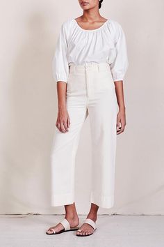 Our favorite, bestselling pant. A flattering, high-rise fit, designed for repeat wear in any season. Cut from a textured cotton, with a menswear-inspired straight waistband. Classic back pockets and nearly hidden front pockets add functionality. Slight crop at the ankle, with a zipper closure and Apiece Apart's signature double buttons. Spring Wide Leg Work Pants, Elegant High-waist Bottoms With Five Pockets, Elegant High Waist Bottoms With Five Pockets, Chic Cotton Wide Leg Work Pants, Versatile Relaxed Fit Cropped Wide Leg Pants, Versatile Cropped Wide Leg Pants, Elegant Spring Pants With Five Pockets, Chic Cropped Wide Leg Pants With Five Pockets, Elegant High Waist Pants With Five Pockets