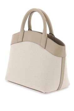 Find SAVETTE Small Round Canvas Tote Bag on Editorialist. The SAVETTE small round tote bag is crafted from cotton canvas with a distinctive silver metal Tondo button and leather finishes. It features a magnetic closure, twill interior with a zip pocket, and double top handles. Designer Beige Top Handle Canvas Bag, Cream Shoulder Bag With Leather Trim And Top Handle, Beige Leather Top Handle Canvas Bag, Beige Leather Canvas Bag With Top Carry Handle, Designer Cream Canvas Shoulder Bag, Luxury Beige Canvas Bag With Handles, Beige Canvas Bag With Leather Trim And Top Handle, Designer Beige Canvas Bag With Leather Handles, Beige Canvas Top Handle Bag With Leather Trim