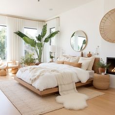 a bedroom with a bed, mirror and fireplace in it's centerpieces