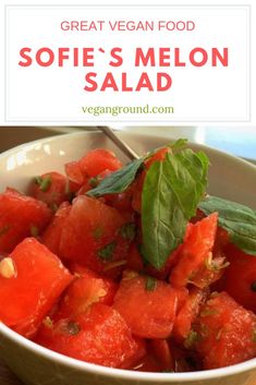 watermelon salad in a bowl with basil leaves on top and the words great vegan food sofie's melon salad