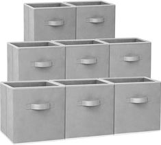 six grey storage bins with handles on each side