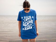 Branded Blue Summer Tops, Summer Blue Tops With Branding, Blue Casual T-shirt With Custom Print, Casual Blue T-shirt With Custom Print, Blue Relaxed Fit T-shirt With Branding, Blue Custom Print Crew Neck Tops, Blue Tops With Custom Print And Crew Neck, Blue Crew Neck Top With Custom Print, Blue Crew Neck Shirt With Custom Print