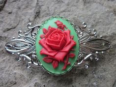 Beautifully unique Christmas cameo barrette, choose from silver or bronze. The cameo is a Christmas rose, perfect for the Holiday season I have several colors and styles to choose from so please do browse, and I can use any cameo in my shop to create this lovely barrette, so please do browse and message me with your choice, I can also hand paint the cameos for a small fee of $3.00, so the choices are endless. The barrettes are antiqued brushed bronze filigree, and a shiny silver, both lead and n Handmade Red Hair Accessories For Gifts, Festive Hair, Christmas Hair Accessories, Christmas Rose, Christmas Hair, Brushed Bronze, Pretty Necklaces, Hand Paint, Coin Jewelry