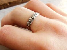 Christmas Cut off is Decemeber 5th for made to order items. Ready to ship items will be cut off Dec 15th Want 20% off this item? Go here to claim your coupon code! https://pintody.com/pages/discounts This Sterling Silver floral pattern ring features a unique design perfect for women or men. A floral design that has leaves and small flowers throughout the design. Great for wedding bands for both him and her or just to wear as a stacking ring with plain or other textures. The band has been oxidize Dainty Engraved Toe Ring For Wedding, Engraved White Gold Flower Ring For Wedding, Vintage Wedding Toe Ring With Flower Design, Vintage Wedding Flower Toe Ring, Flower Shaped Ring With Intricate Design For Anniversary, Elegant Engraved Flower Ring For Wedding, Wedding Engraved Ring With Etched Details, Elegant Adjustable Engraved Flower Ring, Classic Engraved Flower Ring For Wedding