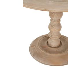 a wooden table with a round base on it