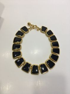 "Beautiful Anne Klein statement necklace. Modernist design in a shiny gold tone and black enamel featuring a toggle closure. CONDITION In excellent vintage condition. No wear, marks or damage. Closures are all secure The necklace measures approximately 17 3/4 inches and 1 1/8\" wide. The necklace is signed with © Anne Klein on one side of the tag and the lion's head on the underside. The necklace is also signed ©AK on a cartouche on one link. It is in excellent vintage condition Please see this Retro Black Metal Necklace, Gold Necklace With Black Enamel For Formal Occasions, Retro Black Necklace For Formal Occasions, Formal Gold-tone Toggle Necklace, Retro Black Jewelry For Formal Occasions, Vintage Black Enamel Jewelry, Black Vintage Enamel Jewelry, Formal Black Enamel Necklaces, Formal Black Enamel Necklace