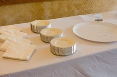 white plates and napkins are on a table