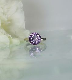 To see a video of this Round Amethyst Solitaire Ring in natural light please visit https://www.instagram.com/tv/CadejF8Dfsb/? Round amethyst solitaire ring is stunning. Natural royal purple amethyst is 100 percent natural and has not been chemically enhanced in anyway. Amethyst is eye clean and has sparkling clarity. This gem weighs 3 carats and measures 10mm with a deep vivid color saturation. Set in a beautifully crafted sterling silver filigree design. Amethyst is believed to have healing pro Purple Amethyst Gemstones With Prong Setting, Purple Amethyst Gemstone With Center Stone, Fine Jewelry Amethyst Solitaire Ring, Amethyst Promise Ring With Vs Clarity, Purple Amethyst Ring With Center Round Stone, Solitaire Amethyst Ring In Fine Jewelry Style, Purple Amethyst Ring With Center Stone, Fine Jewelry Lavender Amethyst Ring With Prong Setting, Purple Amethyst Ring With Round Cut And Accent Stones