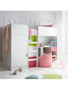 a child's bedroom with white and pink furniture