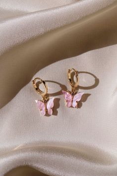 * 18 kt Gold Plated Pastel Butterflies * 14 kt Gold Filled Huggie Hoops Dainty, Simple, & Beautiful 18 kt Gold 3D Pastel Pink Butterflies on 14 kt Gold filled Huggie Hoops that are great for those with sensitive ears. These are super cute! They make a great gift for others or even for yourself. They are simple, dainty, and feminine. I also make these lovely butterfly hoop earrings with Sterling Hoops. Please choose which you would like from the drop down menu. * * What is gold filled? It is a very specialized process which involves fusing a layer of solid 14 kt Gold to brass through high heat and pressure. The bond that is created is a permanent one. The outer layer is solid gold and it is for this reason, 14 kt gold filled will wear like real gold and will remain bright and shiny. These s Girly Jewelry, Pink Butterfly, Butterfly Earrings, Ear Jewelry, Huggies Earrings, Cute Jewelry, Jewelry Ideas, Crystal Earrings, Body Jewelry