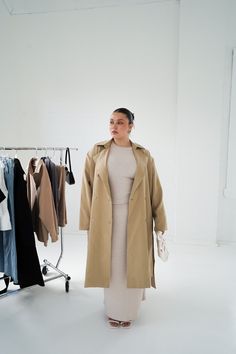 Looking for a go-to winter staple that exudes sophistication and style? Look no further than our new Lennox Trench Coat. More than just outerwear, this piece is a timeless addition to your forever wardrobe. Layer up underneath during the cooler months, or rock on its own over a cute mini dress and boots when the sun starts to come out. Why you'll love this: Timeless, versatile and functional - throw this coat on with literally anything and instantly look put-together Layer up: pair with Downtown Modern Everyday Fall Outerwear, Modern Everyday Outerwear For Fall, Brown Long Coat Outerwear For Everyday, Brown Long Coat For Everyday, Brown Long Coat For Everyday Wear, Modern Khaki Winter Outerwear, Classic Everyday Khaki Outerwear, Classic Khaki Outerwear For Everyday, Oversized Taupe Outerwear For Work