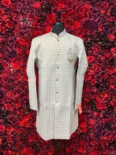 This classic Jodhpuri kurta is a wardrobe essential for every man. Its timeless design and versatile color make it perfect for any occasion. The high-quality fabric ensures comfort and durability. Key Features with Short Descriptions: Color - Snow Off-White with Gold Embroided. Jodhpuri Style: A classic and timeless design. Intricate Embroidery: Adds a touch of elegance and sophistication. Luxurious Fabric: Ensures comfort and durability. Comfortable Fit: Allows for ease of movement. Versatile C Designer Cotton Kurta For Formal Occasions, Designer Straight Kurta For Diwali, Designer White Nehru Jacket, Designer Cotton Bandhgala Straight Kurta, Designer Cotton Bandhgala In Straight Kurta Style, Designer Semi-formal Kurta For Transitional Seasons, Designer Cotton Fitted Sherwani, Designer Fitted Cotton Sherwani, Designer Dabka Kurta