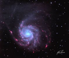 an image of a spiral galaxy in the sky