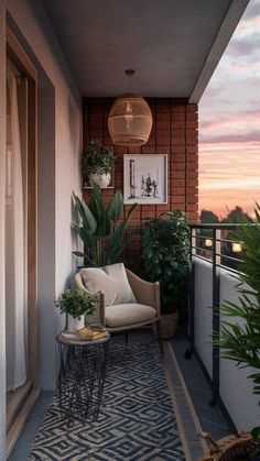 a balcony with potted plants and a chair on the floor next to a table