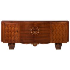 an art deco sideboard with two doors and three drawers on the front, inlaid with flowers