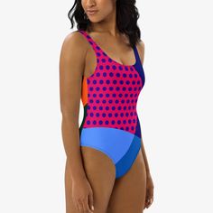 Make a splash with our vibrant "Polkalicious" one-piece swimsuit, designed to flatter all figures with its playful dot design. This swimsuit features smooth, chlorine-resistant fabric that enhances comfort and durability, while the cheeky fit, scoop neckline, and low scoop back offer a stylish look. The double-layered front and four-way stretch material ensure both coverage and ease of movement, perfect for a day by the sea or pool. Embrace style and function in one chic Swimsuit. Polka Dot Swimwear For Summer, Polka Dot Swimwear For Summer Swimming, Fitted Multicolor One-piece For Sunbathing, Fitted Playful Swimwear, Fitted Playful Swimwear For Swimming, Polka Dot Fitted Swimwear, Fitted Polka Dot Swimwear, Polka Dot One-piece Swimwear For Pool, Polka Dot Summer Swimwear For Pool