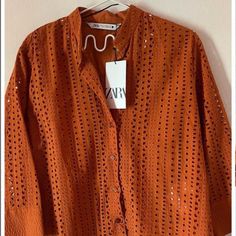 Zara Burnt Orange Openwork Embroidered Button Front Blouse Eyelet Size: S Authentic Zara (Bnwt) Spring/Summer Collection 2022 Round Collar Shirt With V-Neck Front And Cuffed Long Sleeves. Embroidered Eyelet Detail And Pronounced Tonal Topstitching. Back Pleat. Asymmetric Hem. Front Button Closure. New With Tags. Never Worn. Also Selling The Matching Pants In My List. Summer Button-up Shirt With Broderie Anglaise, Zara Embroidered Blouse For Workwear, Casual Collared Blouse With Broderie Anglaise, Summer Button-up Blouse With Broderie Anglaise, Casual Collared Broderie Anglaise Blouse, Summer Long Sleeve Tops With Cutwork, Summer Long Sleeve Cutwork Tops, Zara Cotton Blouse With Buttons, Spring Long Sleeve Blouse With Cutwork