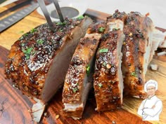 some meat is cut up on a cutting board