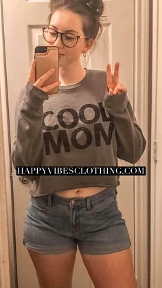 This buttery soft sweatshirt is every womans dream. The sweater is modestly cropped with a raw hem and longer length sleeves. Let the world know what a cool mom you are.