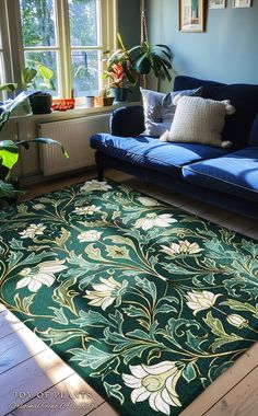 a living room with blue couches and green rug